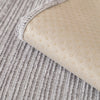 A beige geometric sofa cushion cover with a textured fabric and a light gray knitted background.