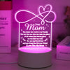 A glowing pink heart design on a white base, featuring text that says Dear Mom and expresses love.