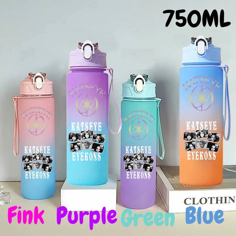 A set of three 750ml portable sports water bottles in pink, purple, and blue colors displayed on a light surface.