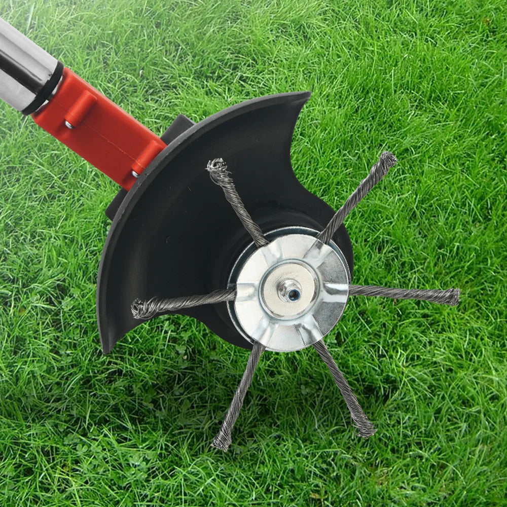 A black steel wire trimmer brush head is shown lying on green grass.