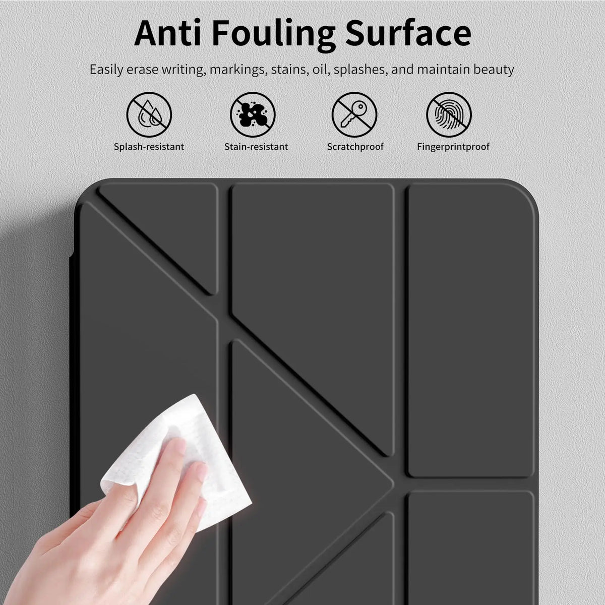 A hand wipes a dark gray magnetic flip smart cover for an iPad, highlighting its anti-fouling surface features.