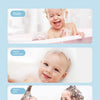 A baby is being bathed and has a happy expression while using a soft mesh bath sponge ball.