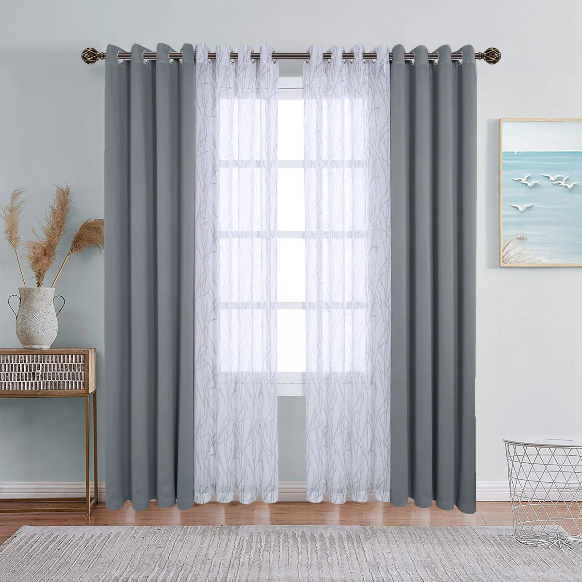 Gray dual layer window curtains featuring sheer and blackout fabric hanging on a rod.