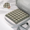 A beige press-to-inflate seat cushion with individual air cells is shown in an open seat, demonstrating its use.