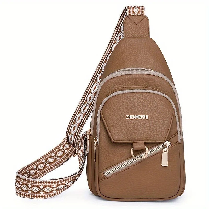 A brown PU leather crossbody bag with a patterned strap and gold hardware.