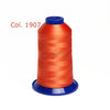 A spool of bright orange embroidery thread labeled Col. 1907.