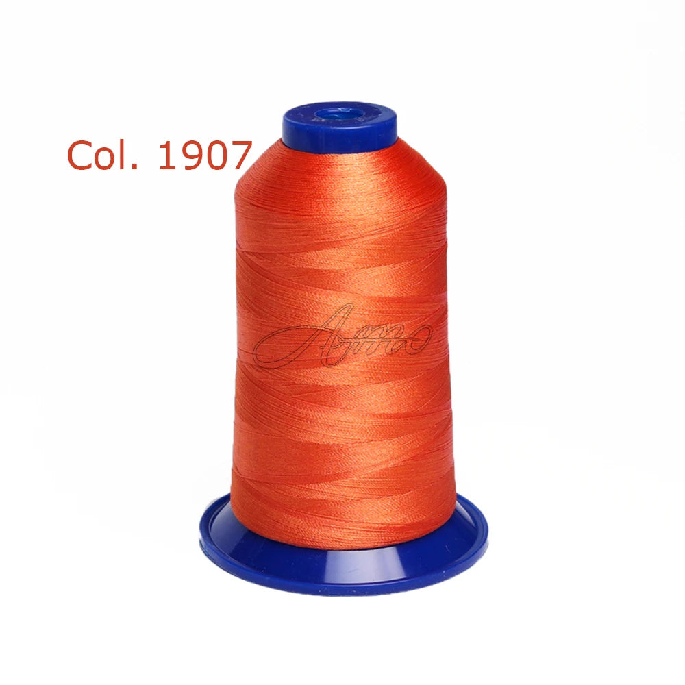 A spool of bright orange embroidery thread labeled Col. 1907.