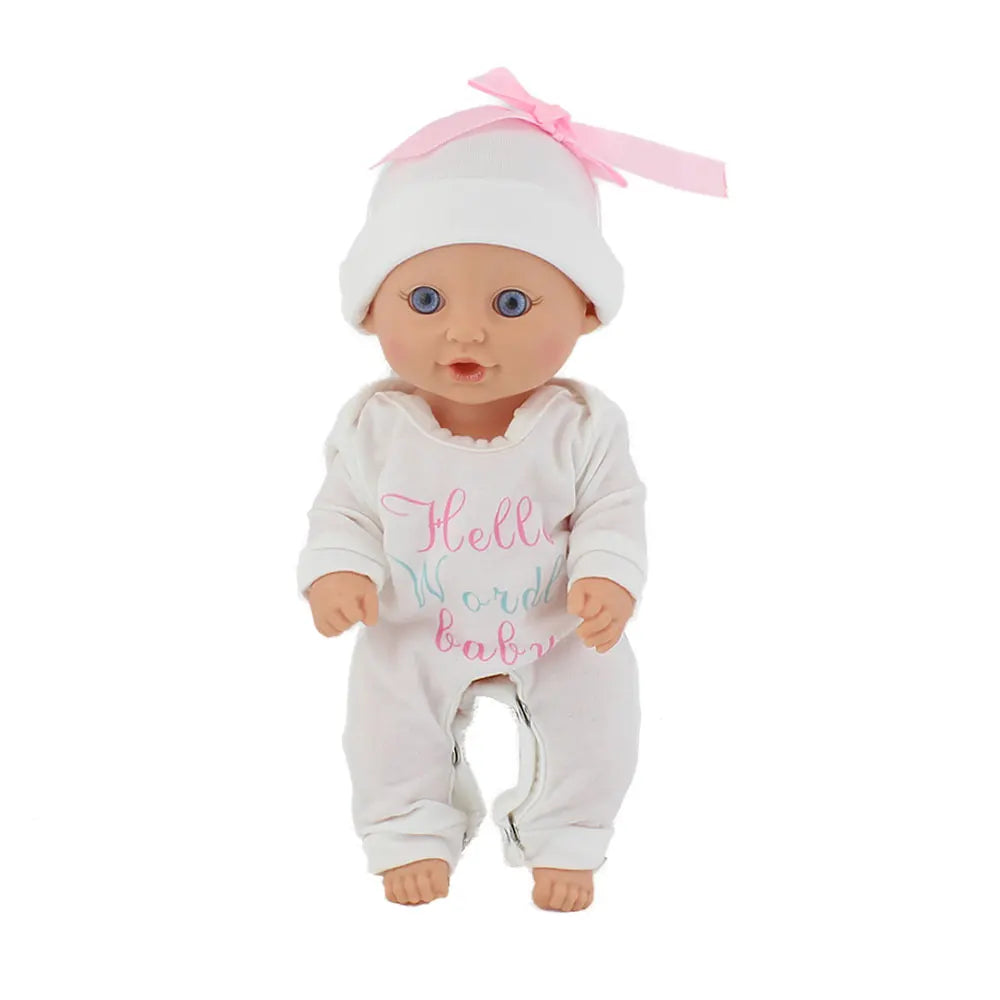 A baby doll wearing a white jumpsuit outfit with pink accents and a pink bow.