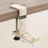 A beige foldable aluminum desk hook with a vertical rod and a horizontal arm, shown against a wooden surface.