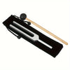 A set of three metal tuning forks with wooden mallets displayed in a black case for sound healing.