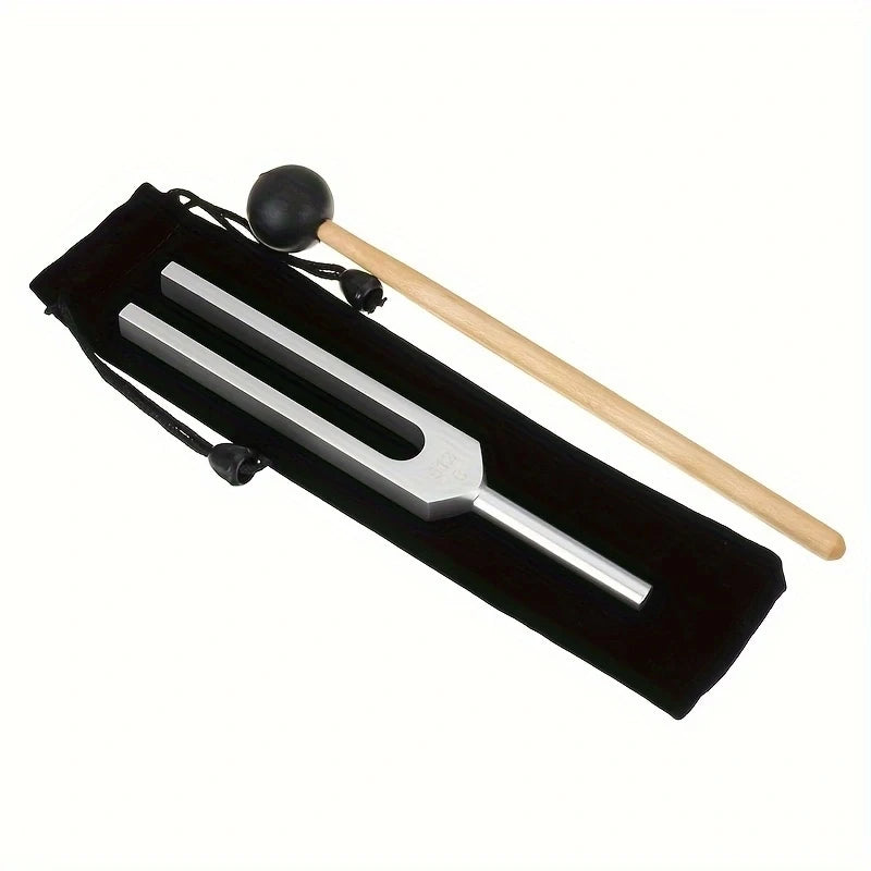 A set of three metal tuning forks with wooden mallets displayed in a black case for sound healing.