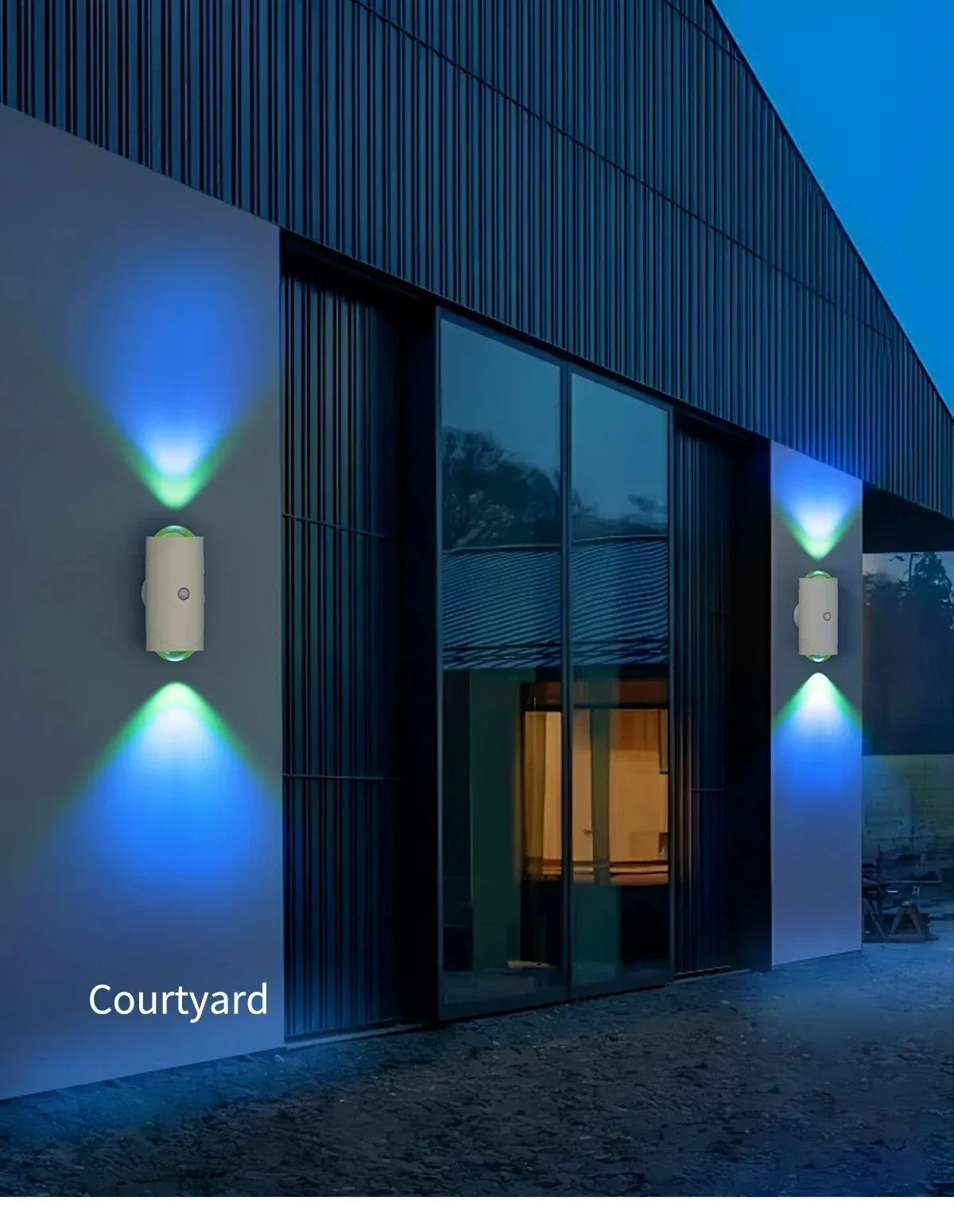 Exterior view of a modern building featuring wall-mounted rechargeable RGB motion sensor lights illuminating the facade.