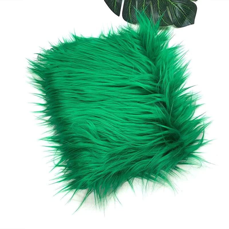 A vibrant green faux fur fabric with long, soft fibers.