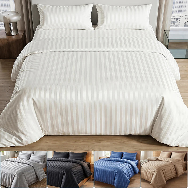 A set of white and beige satin striped jacquard duvet covers displayed on a bed.