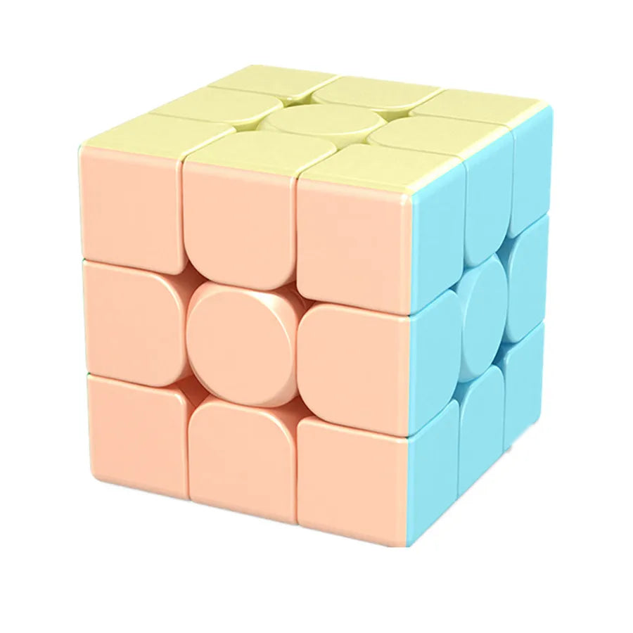 A stack of light pink and pale yellow stickerless speed cubes.