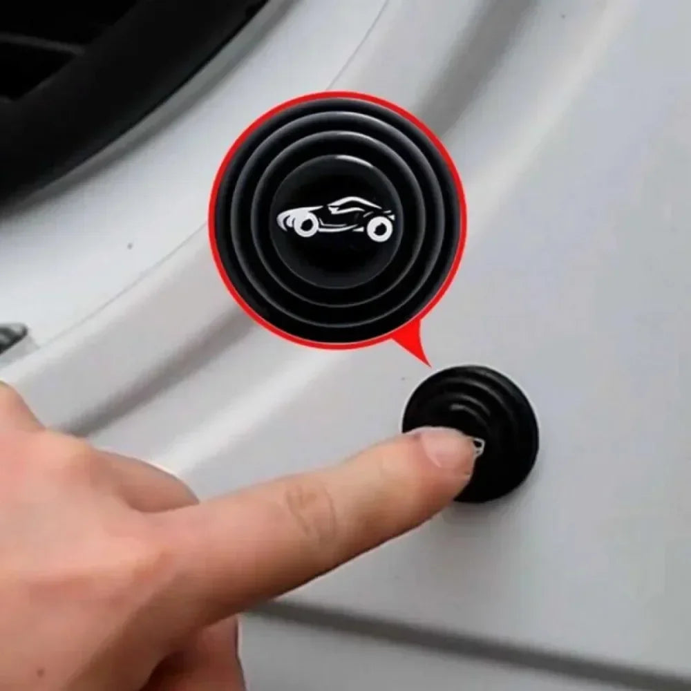 A hand is pressing a black silicone pad on a white car door, next to an indicator showing a car icon.