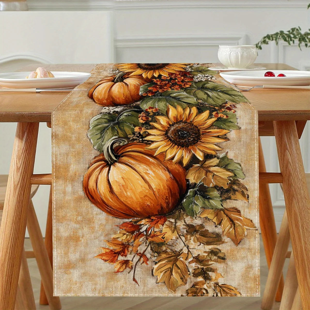 Autumn harvest table runner featuring pumpkins and sunflowers on a wooden table.