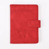 A red leather passport holder embossed with a world map and the word PASSPORT.