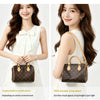 A woman models a brown synthetic leather handbag with a gold strap, shown in two views.