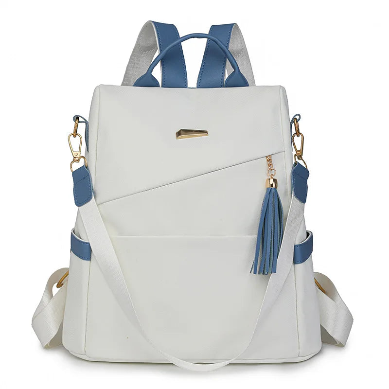 A white vegan leather backpack with blue accents and a laptop compartment.