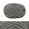 A ball of gray chunky chenille yarn used for hand knitting and crochet