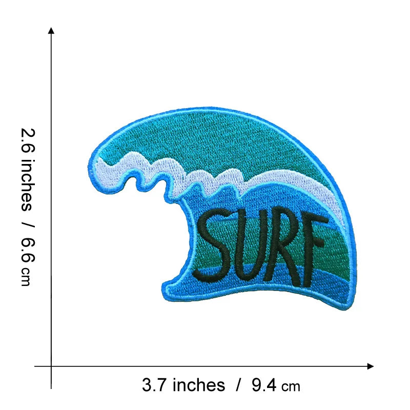 A teal and blue embroidered patch shaped like a sea wave with the word SURF on it.
