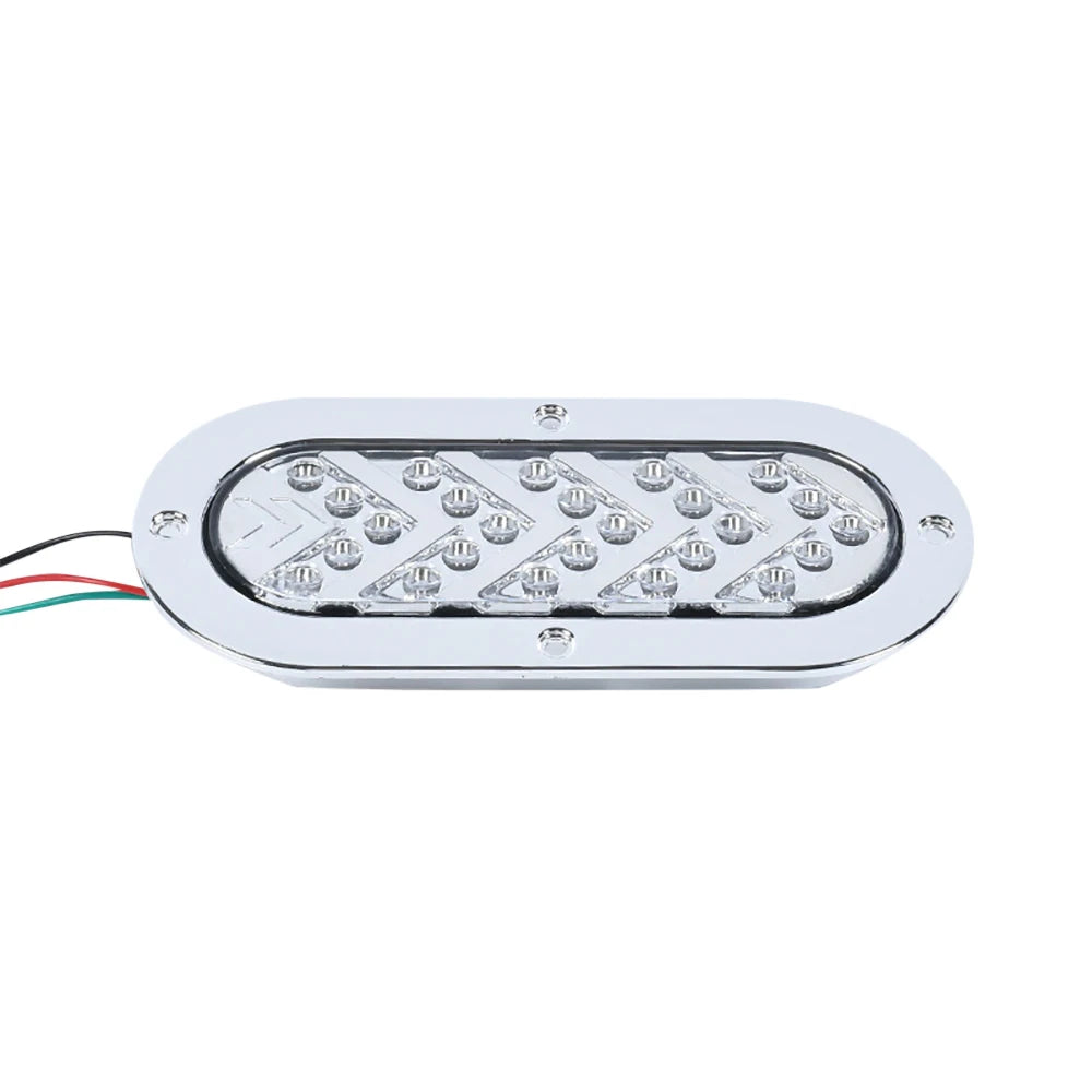 A silver oval LED trailer tail light with a dynamic amber arrow turn signal.