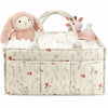 A floral diaper organizer bag featuring a pink bunny plush and multiple compartments for baby supplies.