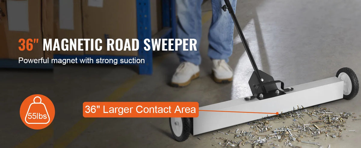 A 36 inch magnetic road sweeper with a long handle and wheels is shown on a concrete floor.