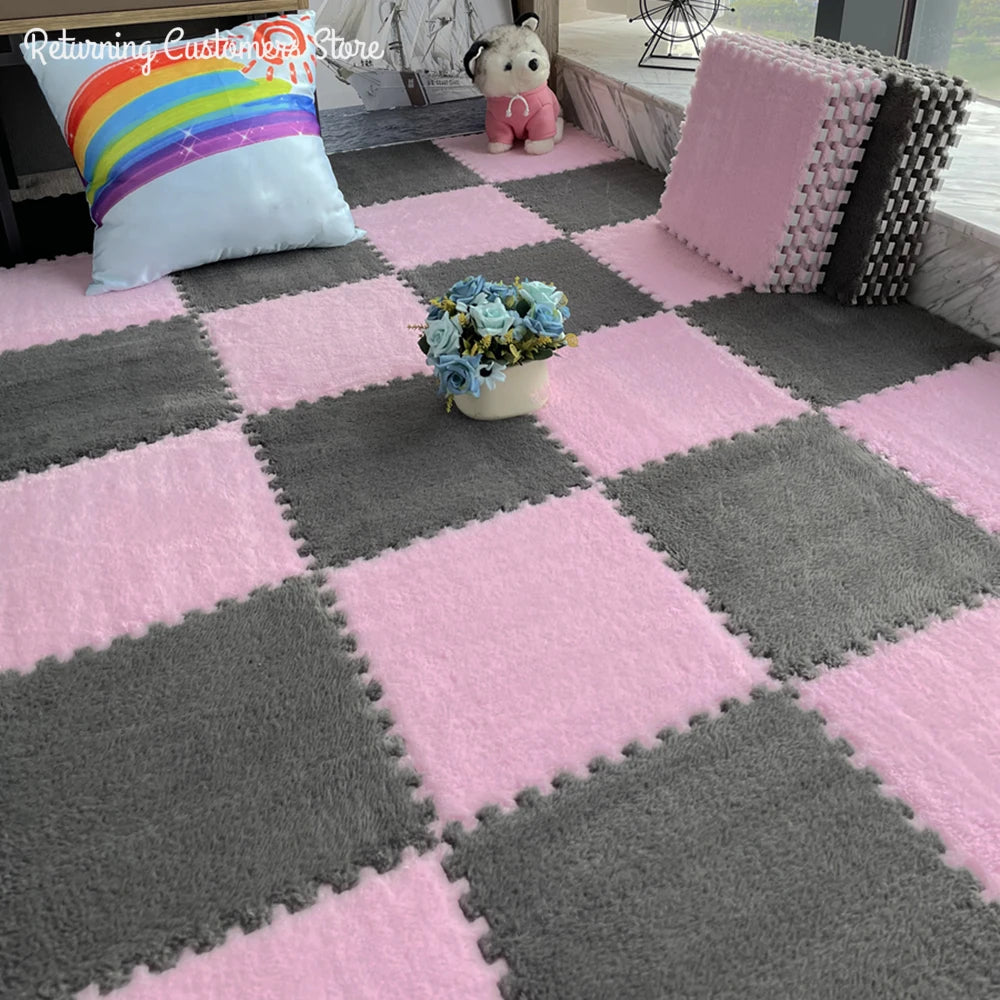 Pink and gray interlocking foam floor tiles with a unicorn pillow and a plush animal decoration