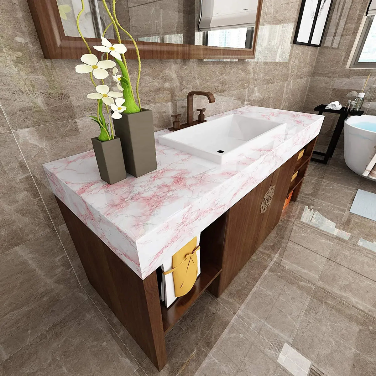 A modern bathroom vanity featuring a pink marble countertop and white sink set against a tiled wall.