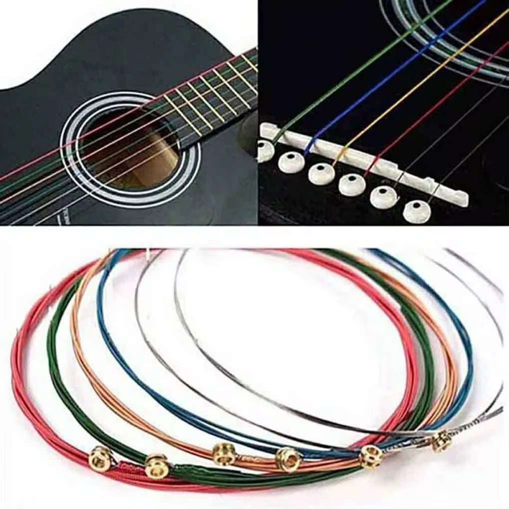 A set of six color-coded acoustic guitar strings, including red, green, blue, and yellow, laid out on a white background.