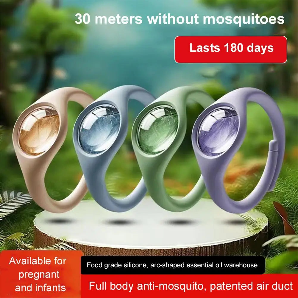 Four colored wristbands of a natural mosquito repellent product displayed on a wooden surface.