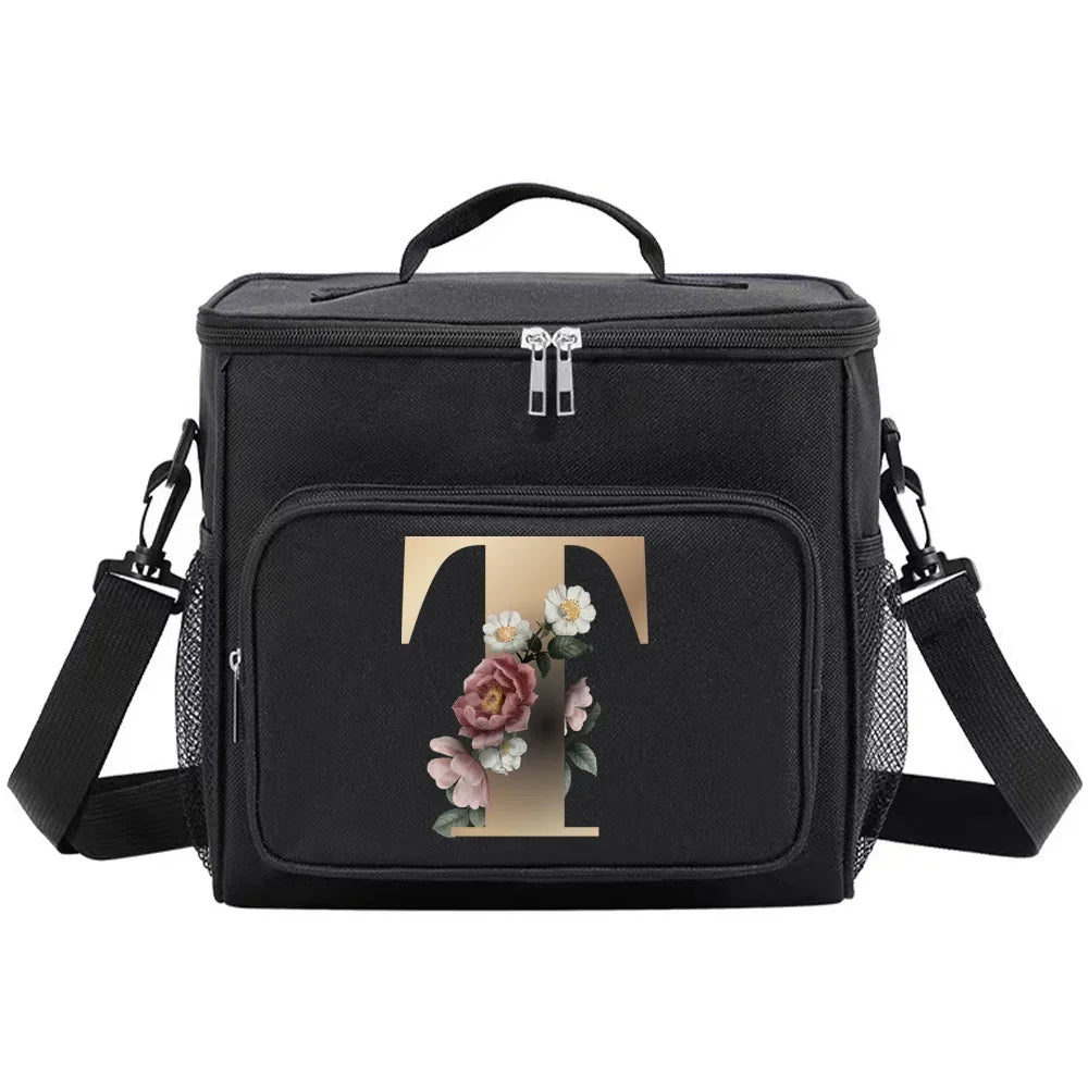Black insulated canvas lunch bag with a gold letter T design and adjustable straps