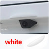 A white universal car rear camera rain cover shield is shown in a close-up view.