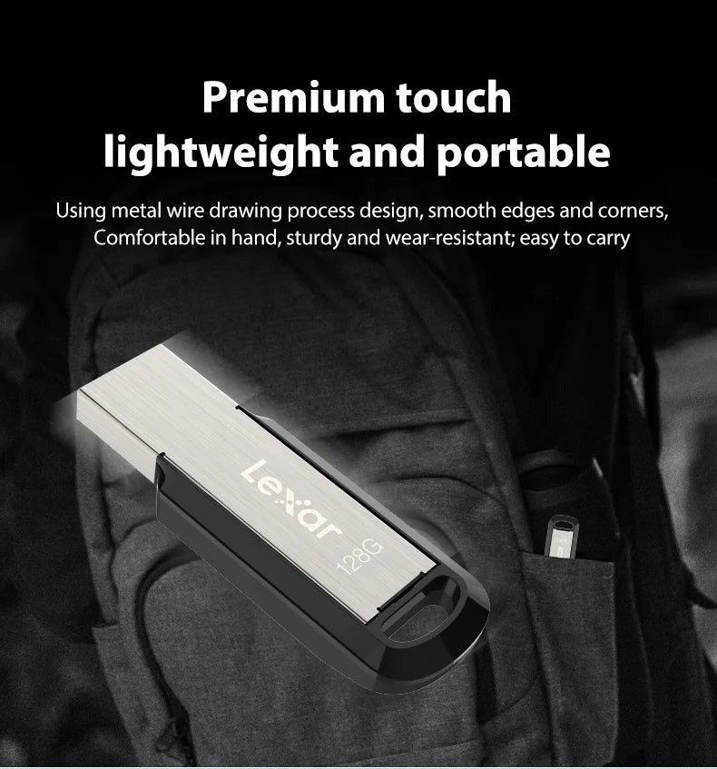 A silver Lexar 128GB flash drive is shown resting inside a dark fabric pouch.
