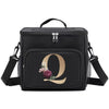 Black insulated canvas lunch bag with a gold letter Q and floral accents