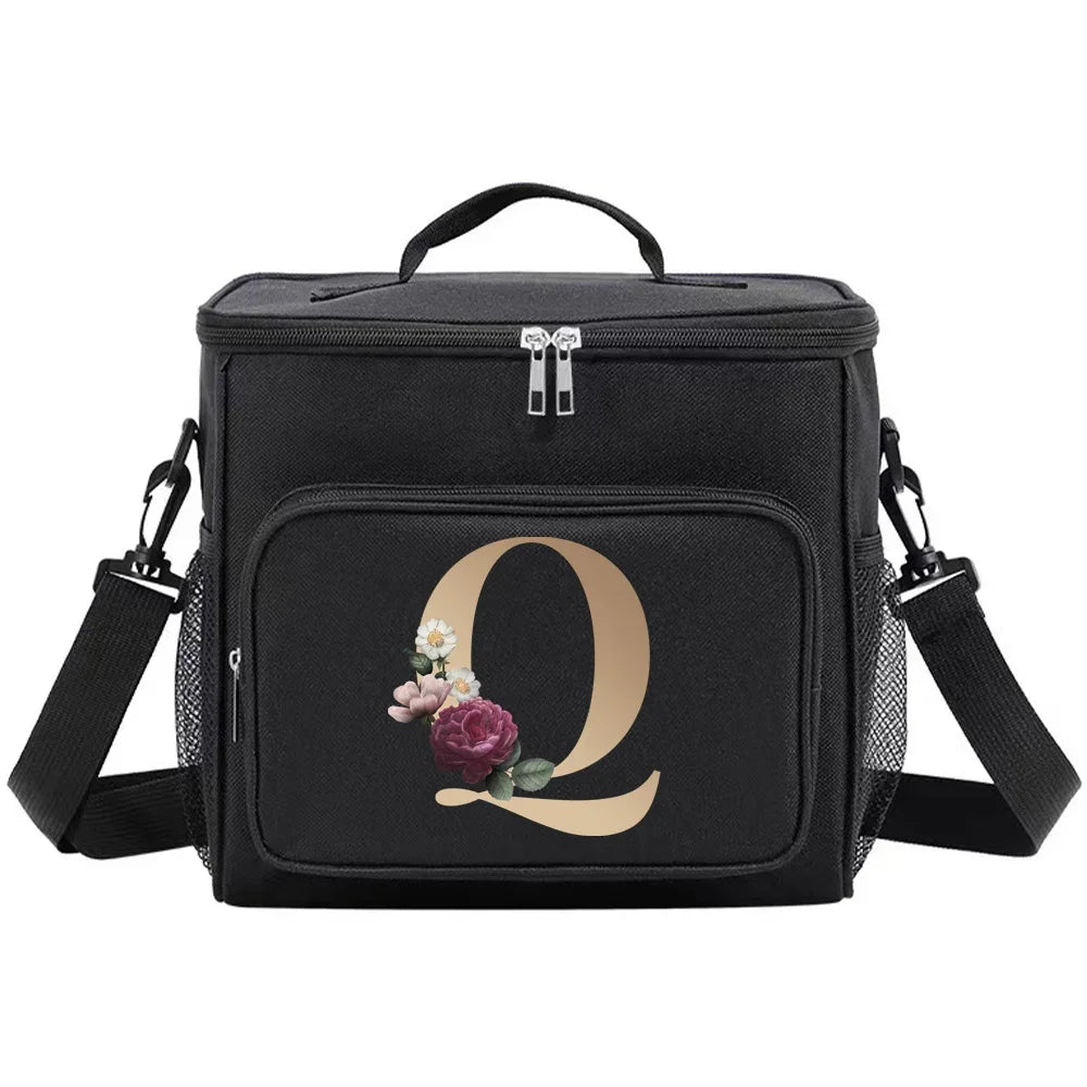 Black insulated canvas lunch bag with a gold letter Q and floral accents