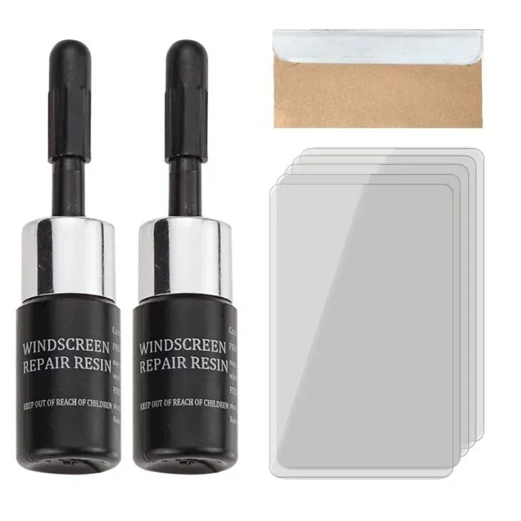 A kit containing two applicator tubes of windshield glass repair resin and a cardboard envelope.