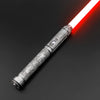 A close-up view of a Neo Pixel lightsaber with a red blade and an ornate silver hilt against a dark background.