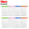 Ten random white foaming mesh bath poufs with colored hanging loops