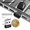 A close-up view of a Super Mini high-speed compact USB flash drive and a gold coin for scale.