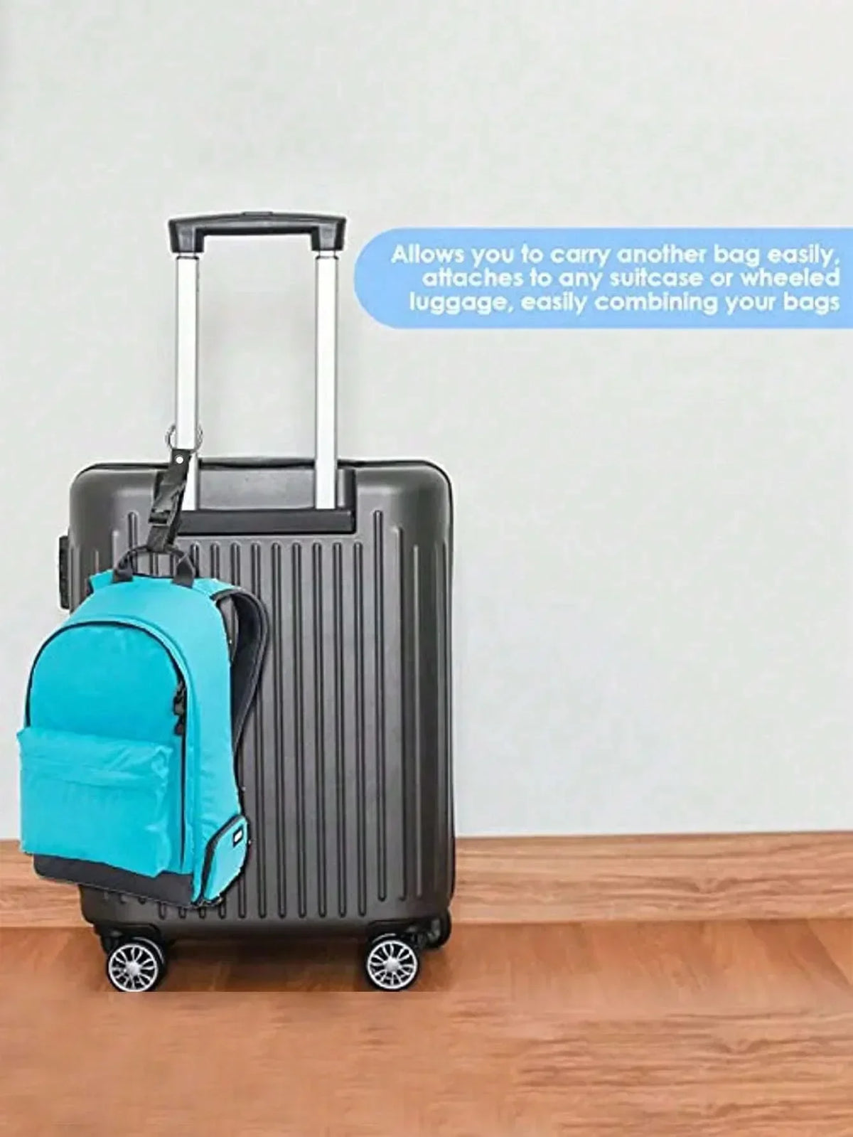 A black rolling suitcase with a bright blue fabric bag attached to the handle.