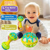 A smiling baby holds a set of three colorful spinning rattle toys for fine motor skills and color recognition.