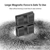 A black magnetic double-sided window cleaner device shown against a textured background.