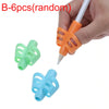Set of six B-shaped pencil grips in green and blue colors being held by a hand