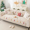 A beige chenille sofa covered with festive Christmas tree patterns and pillows, displayed in a bright room.