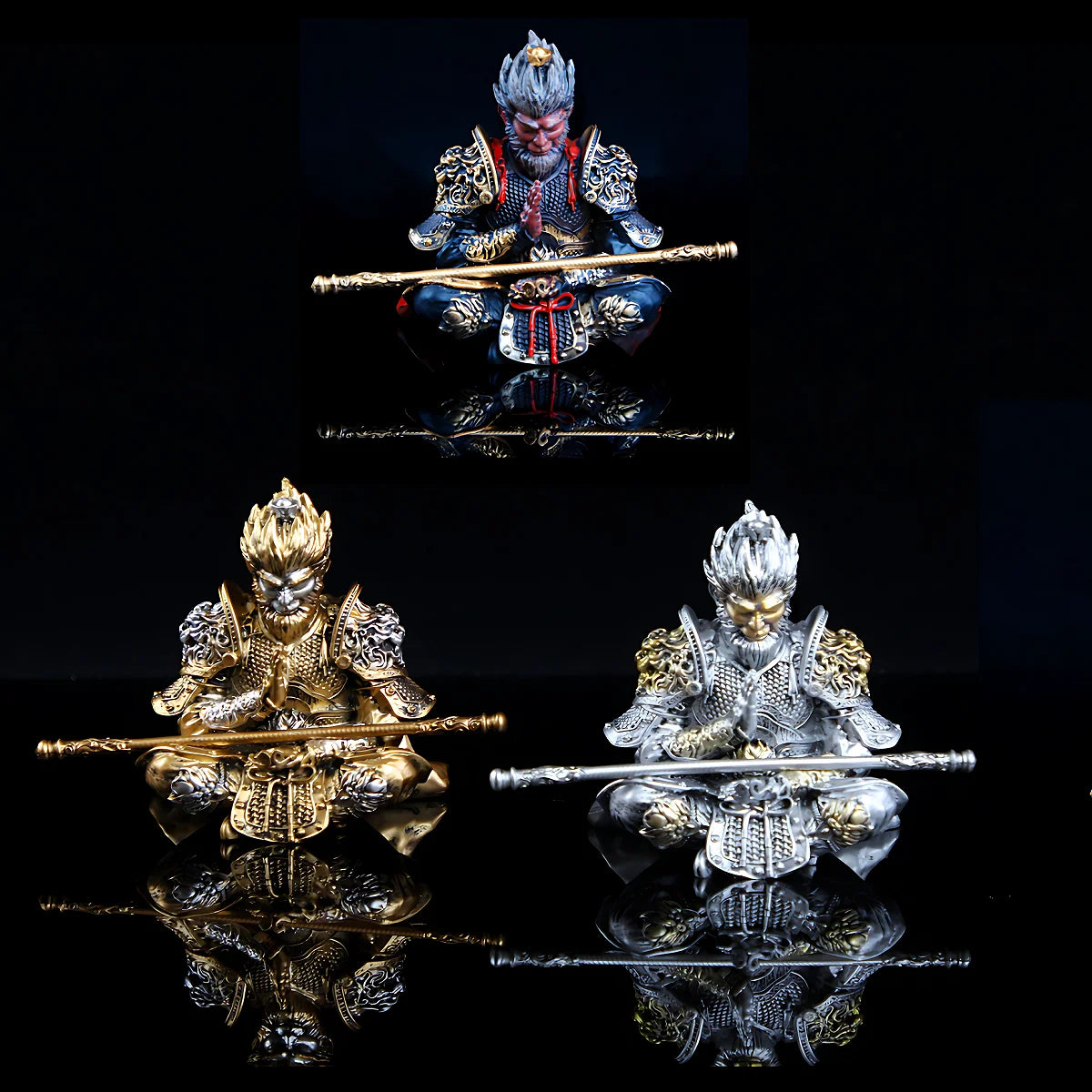 Hand-painted Monkey King figurine in gold and blue armor holding a staff, displayed against a black background.