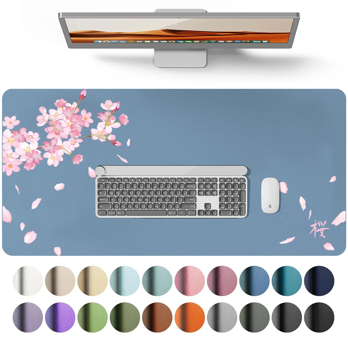 A waterproof PU leather desk pad featuring a keyboard and mouse, surrounded by scattered pink petals and various colored circ