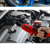 A hand holds an M-WALK cordless right angle ratchet wrench with a brushless motor, used to service a vehicle engine component